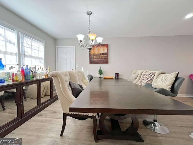 dining room featuring a chandelier and light hardwood / wood-style floors