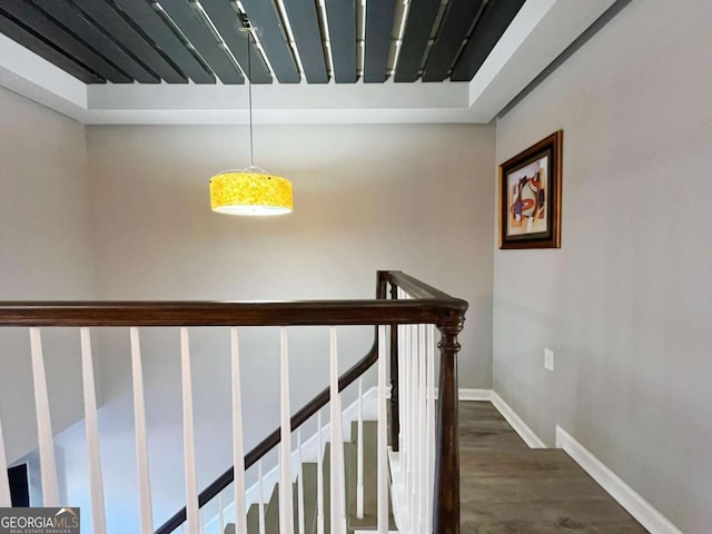 stairs featuring hardwood / wood-style floors