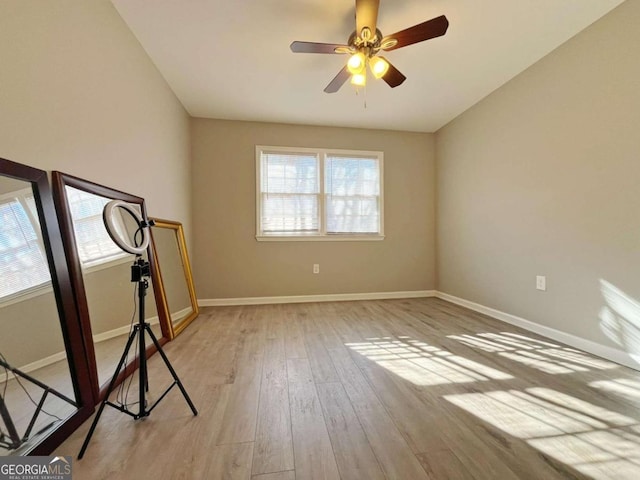 unfurnished room with light hardwood / wood-style floors, ceiling fan, and plenty of natural light