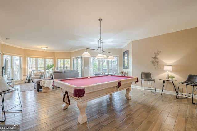 game room featuring ornamental molding, pool table, baseboards, and wood finished floors