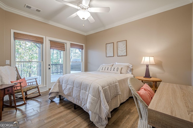 bedroom featuring visible vents, a ceiling fan, wood finished floors, access to outside, and crown molding