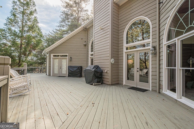 wooden terrace with french doors and grilling area