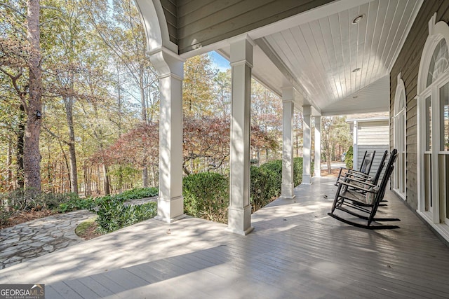 wooden terrace featuring a porch