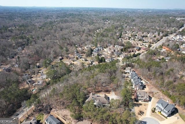 aerial view featuring a view of trees