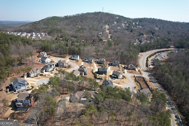 bird's eye view featuring a forest view, a residential view, and a mountain view