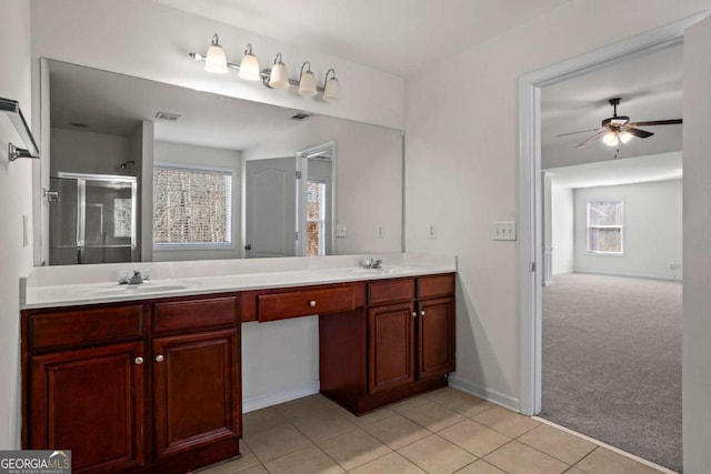 bathroom featuring an enclosed shower, tile patterned flooring, ceiling fan, and vanity