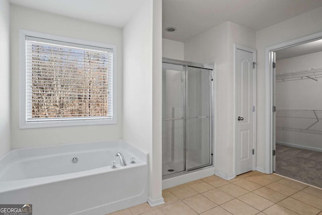 bathroom featuring independent shower and bath and tile patterned flooring