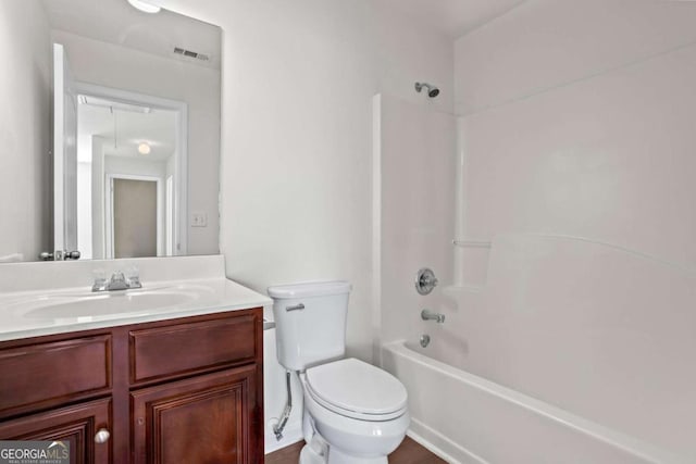 full bathroom with toilet, vanity, and shower / bath combination