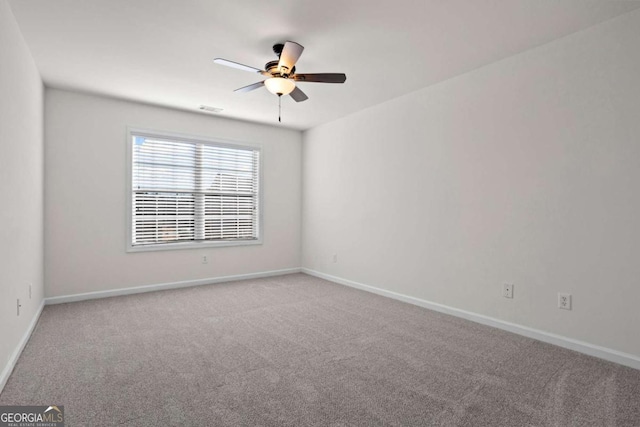 unfurnished room featuring carpet floors and ceiling fan