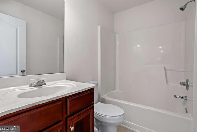 full bathroom featuring shower / bathing tub combination, vanity, and toilet