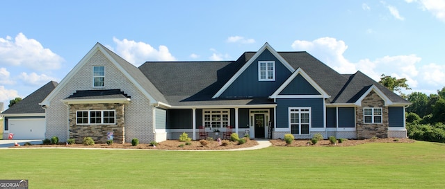 craftsman-style house with a front lawn and a garage