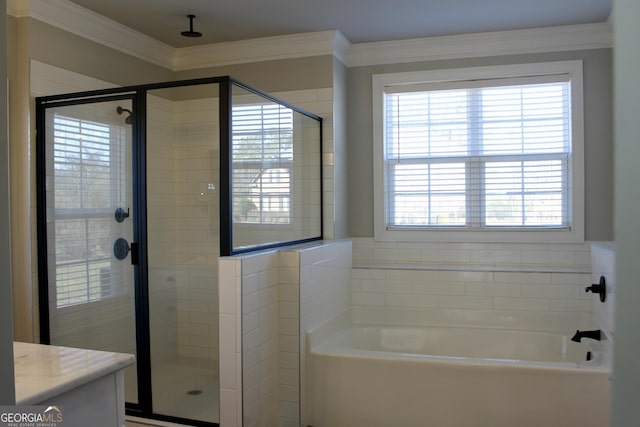 bathroom with ornamental molding, independent shower and bath, and vanity