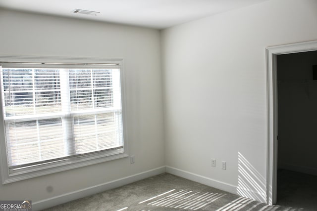 spare room featuring carpet floors