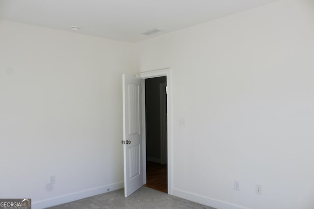 spare room featuring carpet flooring