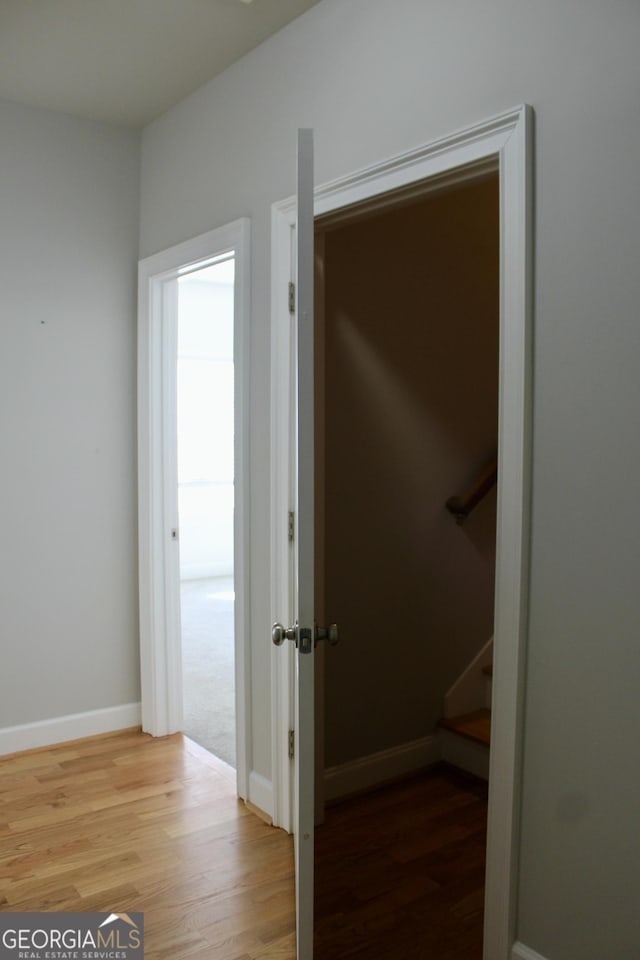 corridor featuring hardwood / wood-style flooring