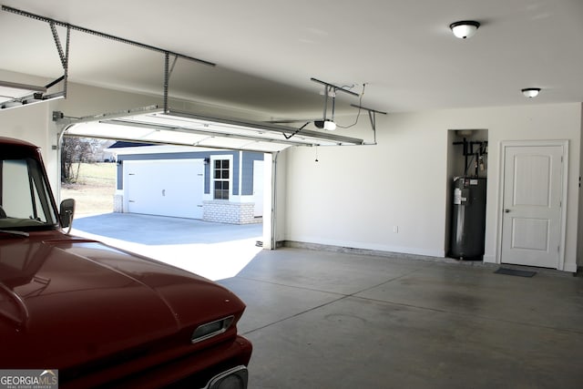 garage featuring water heater and a carport