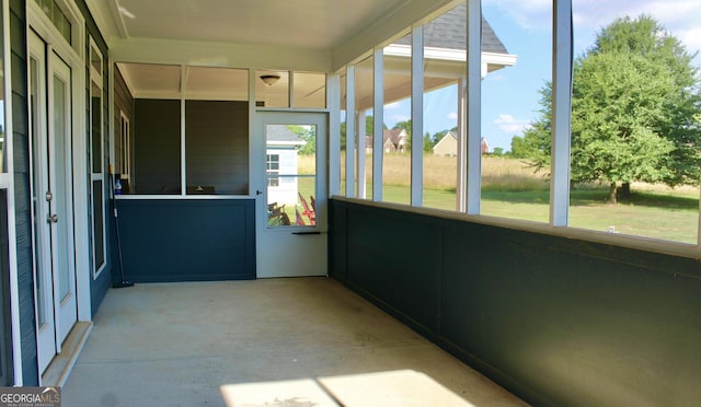 unfurnished sunroom with a wealth of natural light