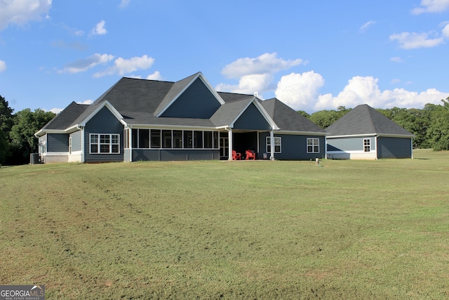 view of front of property featuring a front lawn and a sunroom