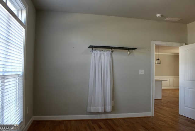 unfurnished room with hardwood / wood-style flooring