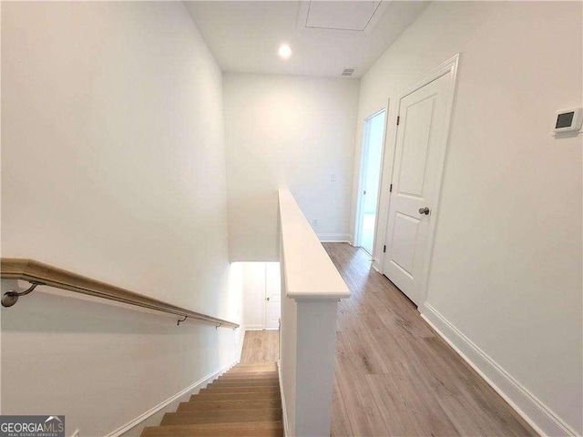 stairway with wood-type flooring