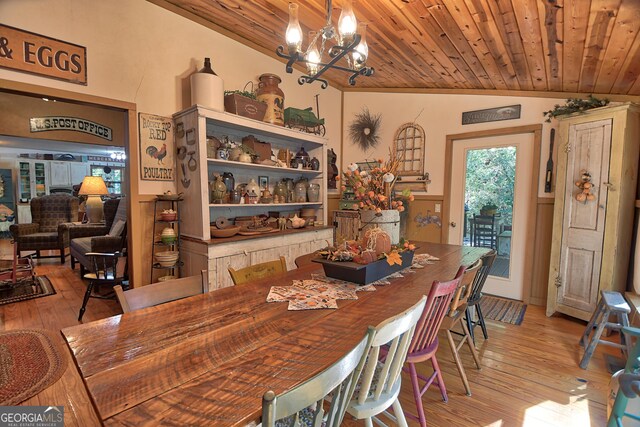 kitchen with sink, a textured ceiling, black appliances, and light hardwood / wood-style flooring