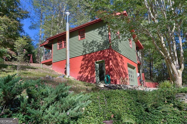 view of side of home with a garage