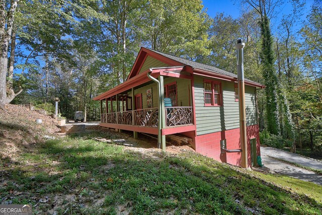 view of property exterior with covered porch