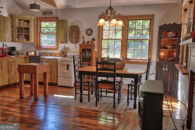 dining room with a chandelier and hardwood / wood-style floors