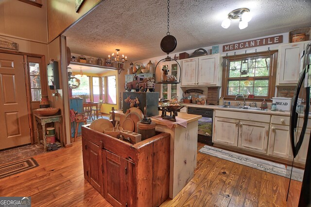 living room with high vaulted ceiling, ceiling fan, and wood-type flooring