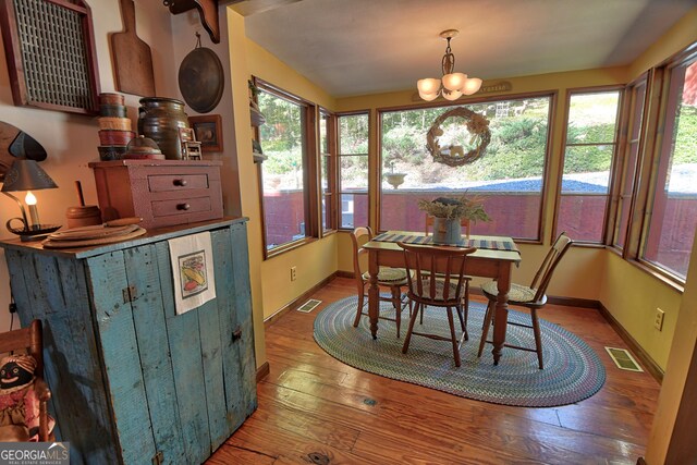 living room with lofted ceiling, a fireplace, hardwood / wood-style floors, and a textured ceiling