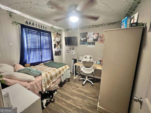 bedroom featuring ceiling fan and hardwood / wood-style floors