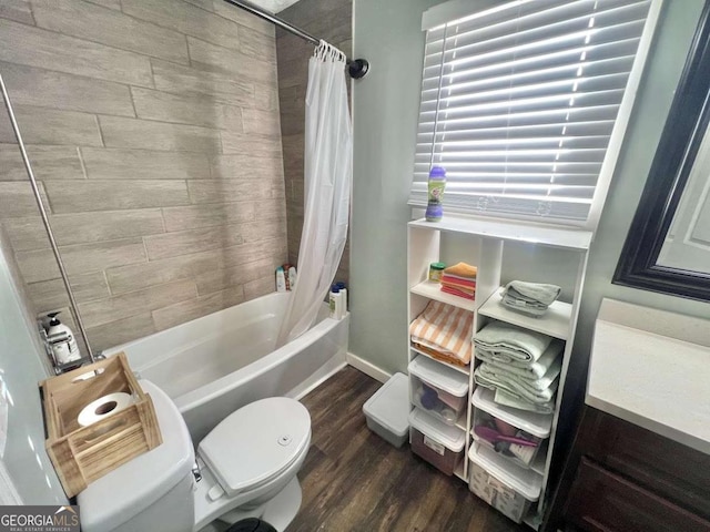 bathroom with hardwood / wood-style flooring, toilet, and shower / bath combo