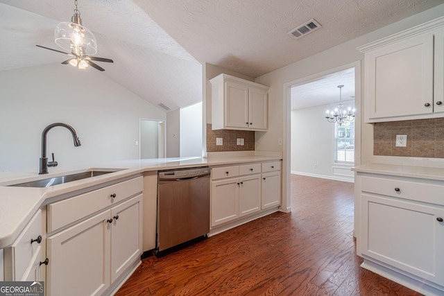 kitchen with decorative backsplash, stainless steel dishwasher, white cabinets, and sink