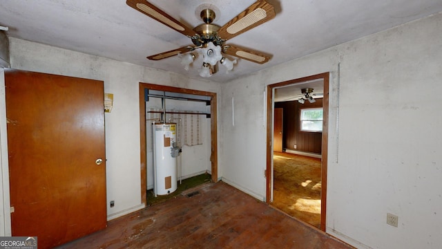 unfurnished bedroom with ceiling fan and electric water heater