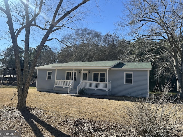 single story home featuring a porch