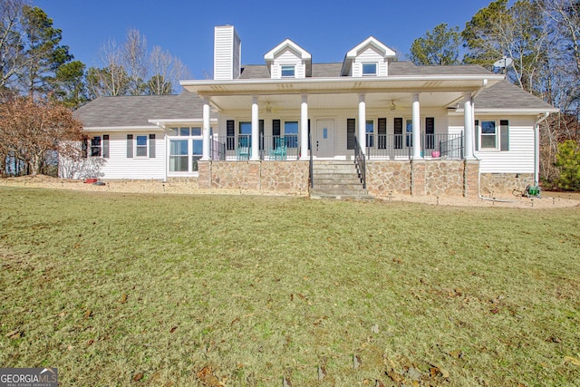 view of front of property with a front lawn and covered porch