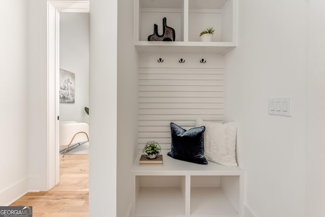 mudroom with light hardwood / wood-style floors