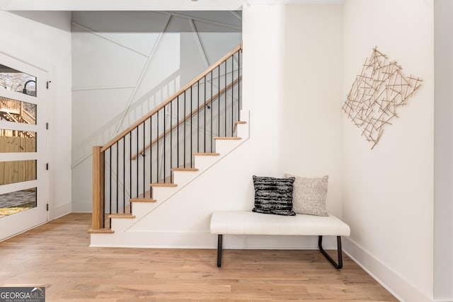 stairs with hardwood / wood-style floors