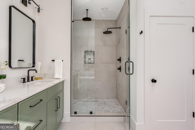 bathroom with vanity, tile patterned flooring, and walk in shower