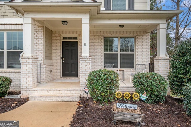 doorway to property with a porch