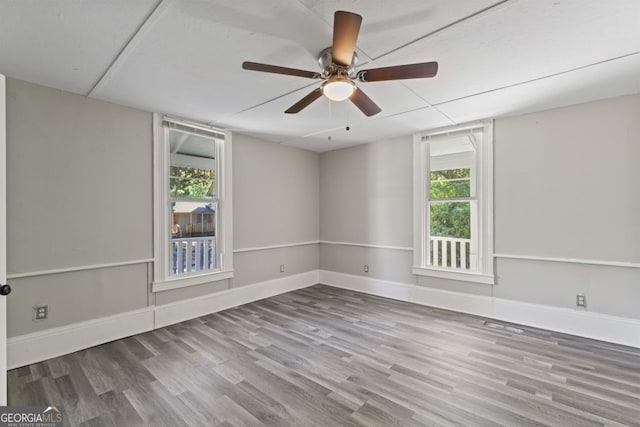 empty room with wood-type flooring and ceiling fan