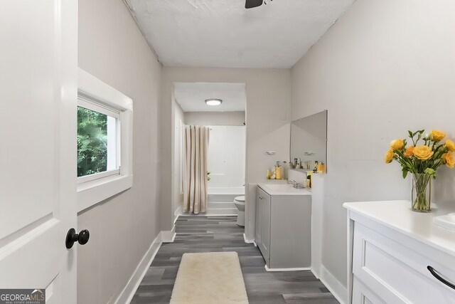 clothes washing area with dark wood-type flooring