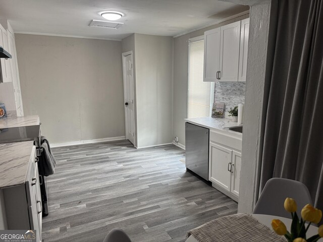 kitchen with white cabinetry, light hardwood / wood-style flooring, and stainless steel electric range