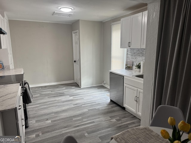 kitchen featuring dishwasher, backsplash, light hardwood / wood-style floors, and white cabinets