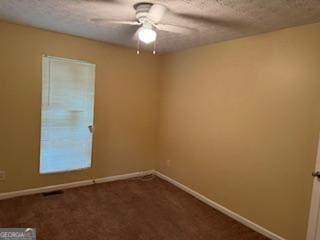 spare room with ceiling fan