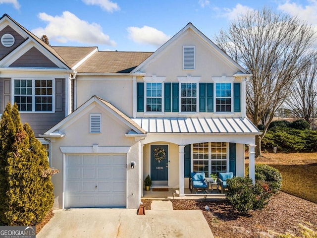 view of front of house featuring a garage and a porch