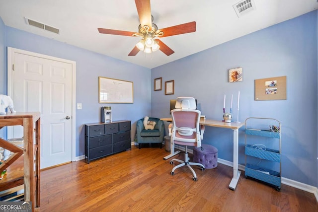 office space with ceiling fan and hardwood / wood-style floors