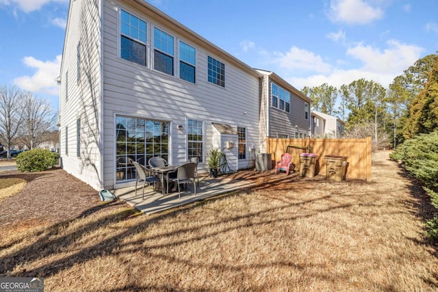 rear view of house with a patio