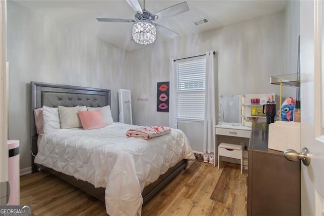 bedroom featuring light wood-type flooring and ceiling fan