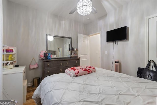 bedroom featuring ceiling fan and wood-type flooring